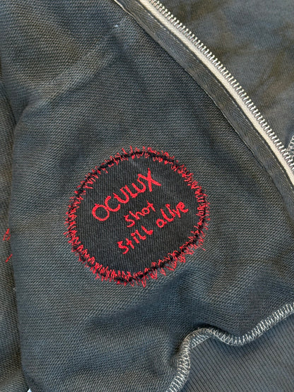 oculux  "shot, still alive"